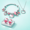 Hello Kitty pink jewelry set with charm bracelet, necklace and strawberry stud earrings