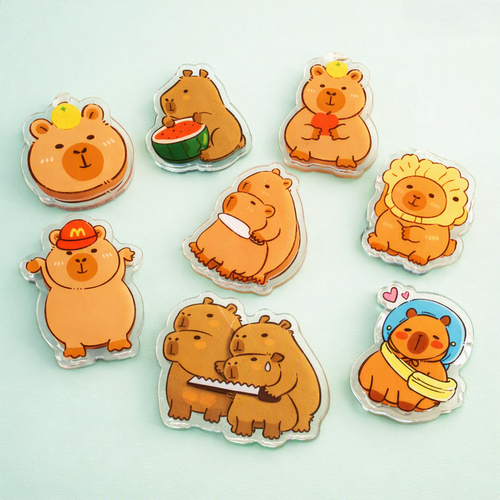 Kawaii capybara acrylic pin holding a heart