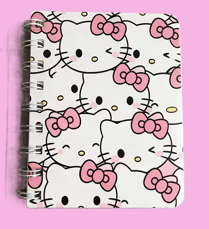 Hello Kitty mini notebook with multiple Hello Kitty poses on pink cover