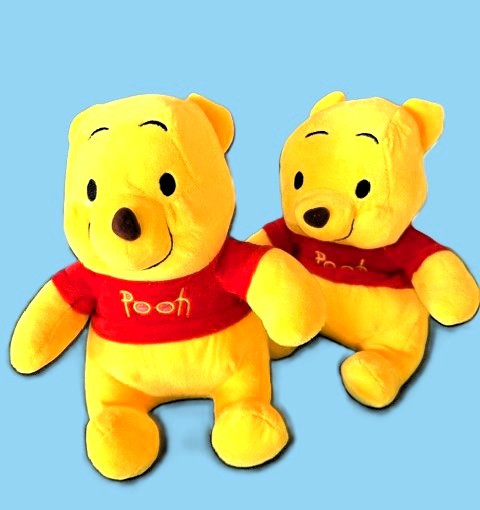 Two Winnie the Pooh plush toys