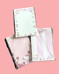Hello Kitty notepads set with lined and grid pages in pastel pink with rose designs