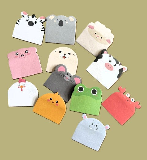 Animal Paradise die-cut sticky note pads featuring hamster, penguin, frog, bunny, and bear in pastel packaging
