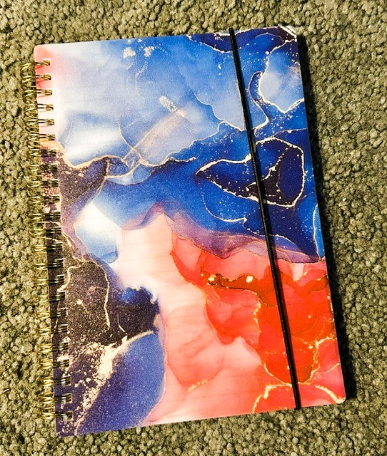 Blue cosmos marble ink spiral notebook with red and navy tones