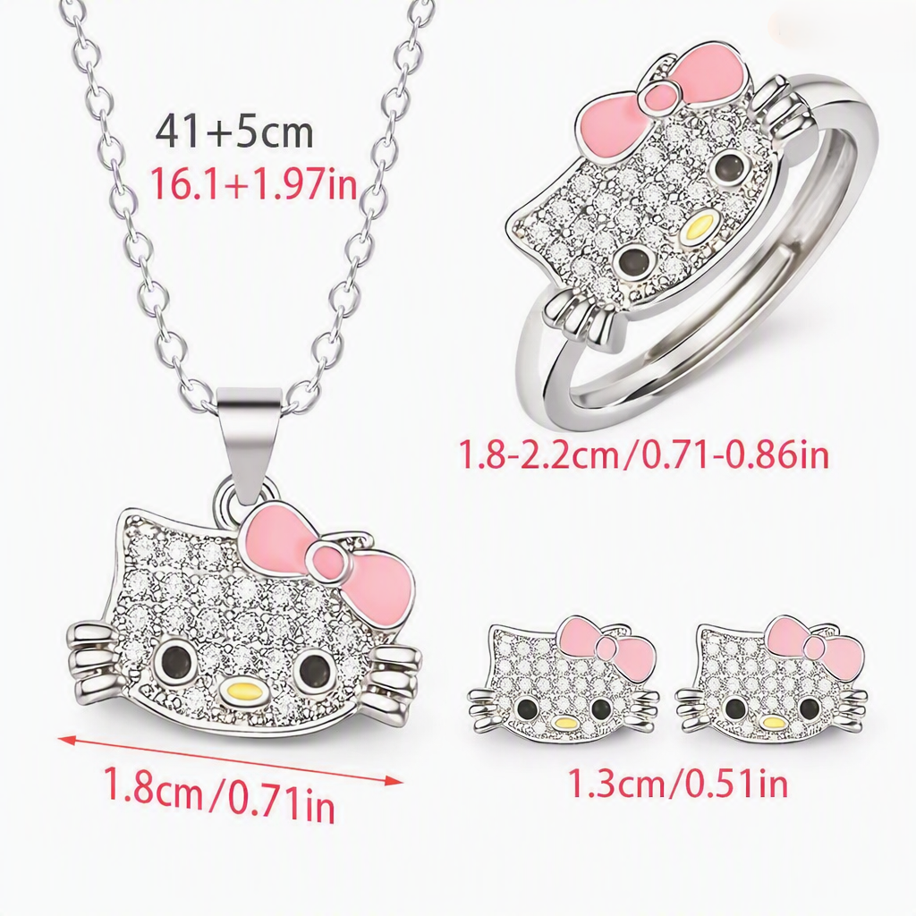 Hello Kitty crystal jewelry set – necklace, ring, and earrings on purple background